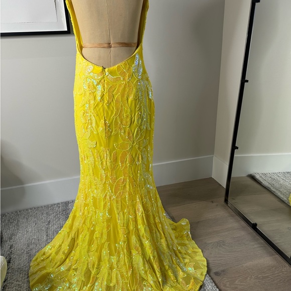 JoVani Yellow Dress
The Jovani 07784A Yellow Pattern Sequin Embellished Gown - Picture 5 of 7